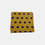 Folded Royal Sunset Blooms Ankara fabric with bright yellow and deep purple floral print on a striped background.