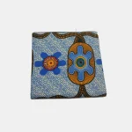 Folded 6-yard Classic Ankara fabric featuring the Tropic Shield Radiance pattern in blue, orange, and magenta.