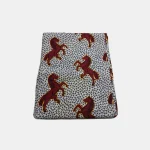 Folded 6-yard piece of Royal Maroon Stallion luxury Ankara fabric featuring rearing maroon horses on a geometric background.