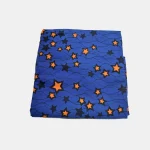 Folded Starry Destiny Ankara fabric, 100% cotton, featuring blue background and orange and black stars.