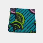 Folded Emerald Shield Current Luxury Ankara fabric featuring teal, lime green, and pink geometric patterns on 100% cotton.